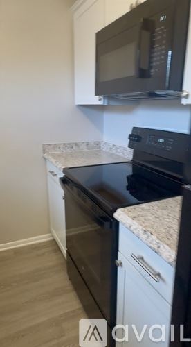 Clearwater apartment for rent - A kitchen with a black countertop and a white wall.
