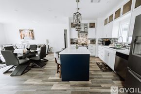 North Hollywood house for rent - A modern kitchen with a dining table and chairs.