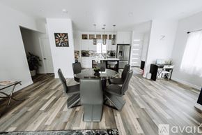 North Hollywood house for rent - A modern dining room with a glass table and chairs.