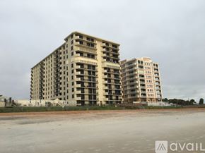 Ormond Beach apartment for rent - A large, unfinished apartment building sits in the middle of a construction site.