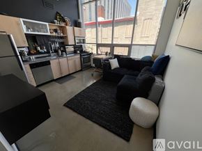 Columbus condo for rent - A kitchen with a black stove top oven and a black fridge.