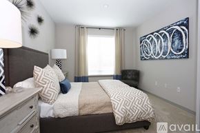 St. Petersburg apartment for rent - A bedroom with a large bed and a painting on the wall.