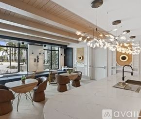 Tampa apartment for rent - A modern dining room with a large table and chairs.