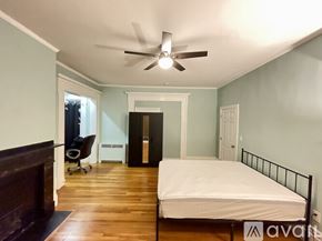 Cambridge apartment for rent - A bedroom with a bed, dresser, and chair.
