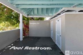 Key West condo for rent - A pool restroom with an emergency exit sign.