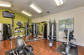 Sacramento apartment for rent - Fitness Center with Ellipticals, Weight Machines and Hardwood Inspired Floors at Monte Bello Apartments, Sacramento, CA