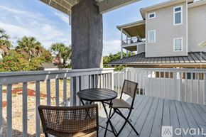 Fernandina Beach townhouse for rent - A balcony with a table and two chairs is available for rent.
