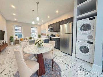 Elizabeth apartment for rent - A modern kitchen with a dining table set up.