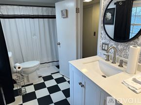 Gordonsville apartment for rent - A black and white checkered bathroom floor.
