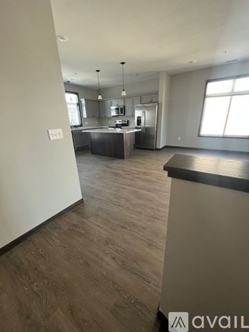 North Mankato apartment for rent - A modern kitchen with wooden floors and a large island.