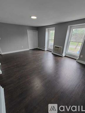 Blackwood apartment for rent - A room with wooden flooring and a window on the right side.