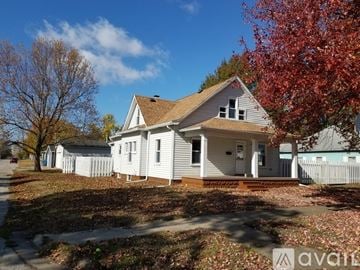 Terre Haute house for rent - A house with a white picket fence in front of it.