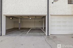 San Diego condo for rent - A white garage door is open to reveal a spacious garage.