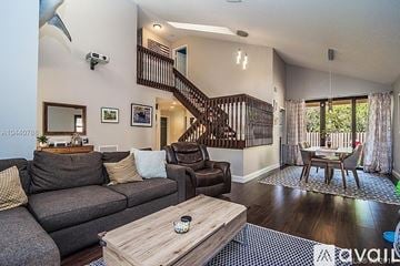 Plantation house for rent - A living room with a grey couch and a wooden coffee table.