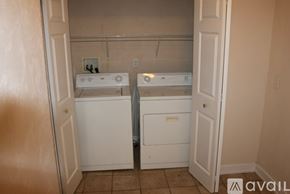 Kalamazoo apartment for rent - A laundry room with a washer and dryer.