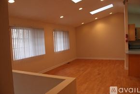 Kalamazoo apartment for rent - A room with wooden floors and a white counter.