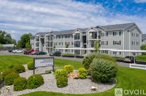 Spokane Valley apartment for rent - A large, multi-story apartment building with a sign that reads "Eaglevale Apartment.".