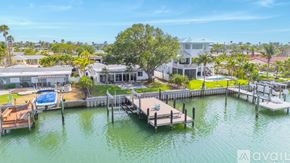 St. Pete Beach house for rent - A house is available for rent on a waterfront property with a dock and a pool.