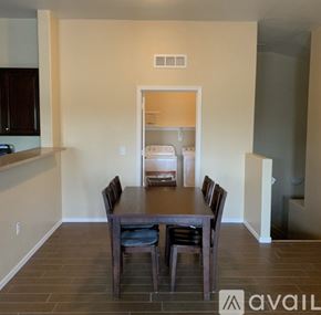 Goodyear townhouse for rent - A dining room with a table and chairs is available for rent.