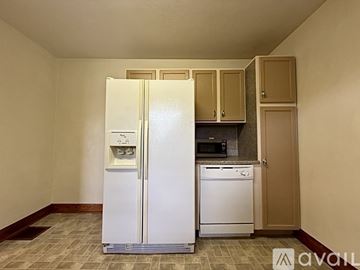 Owensboro apartment for rent - A white refrigerator with its door open in a kitchen.