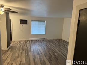 Slinger apartment for rent - A room with wooden flooring and a window.