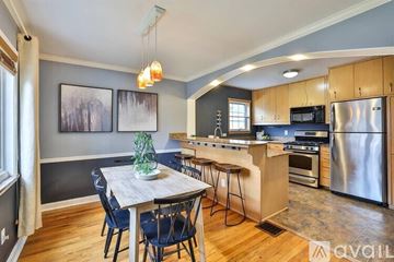 Cincinnati house for rent - A kitchen with a dining table and chairs.