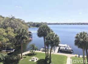 Winter Park apartment for rent - A view of a lake with boats docked at a marina.