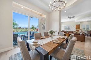 La Quinta house for rent - A dining room with a table set for a meal.