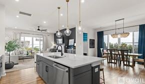 Davidson apartment for rent - A modern kitchen with a large island and pendant lights.