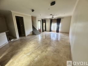 Fort Lauderdale townhouse for rent - A kitchen with granite countertops and stainless steel appliances.