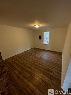 Pittsburgh apartment for rent - A room with wooden flooring and a window.