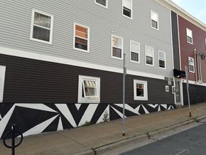 Dartmouth apartment for rent - A building with a black and white design on the side.