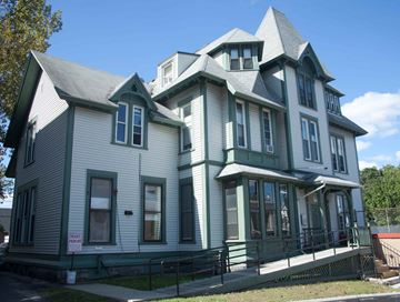 Worcester apartment for rent - A large house with a grey and green exterior.