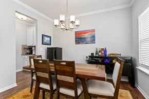 Morrisville house for rent - A dining room with a wooden table and chairs.