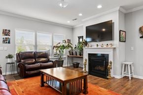 Morrisville house for rent - A living room with a fireplace and a television.