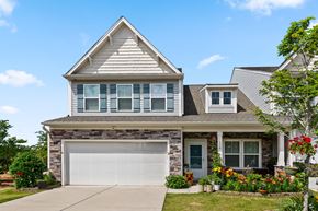 Morrisville house for rent - A house with a grey roof and a white garage door.