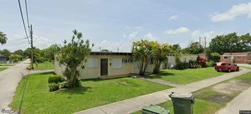 Homestead apartment for rent - A house with a green trash can in front of it.