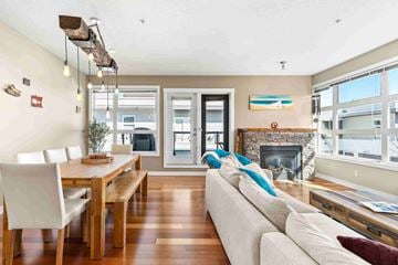 Calgary apartment for rent - A modern living room with a dining table and a fireplace.