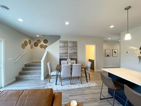 Sioux Center apartment for rent - A modern dining room with a wooden table and chairs.