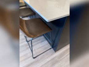 Sioux Center apartment for rent - A brown chair is placed in front of a white table.