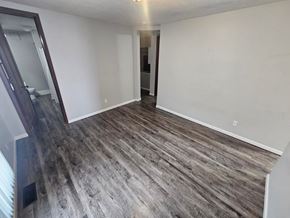 Lima house for rent - A room with a wooden floor and white walls.
