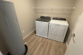 Fargo apartment for rent - A small laundry room with a washer and dryer.