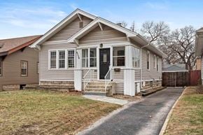 Hammond house for rent - A house with a grey exterior and a black door.