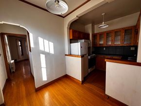 Alameda apartment for rent - A kitchen with wooden floors and white walls.