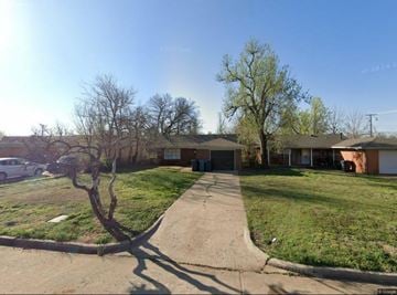 Oklahoma City house for rent - A residential area with houses and trees.