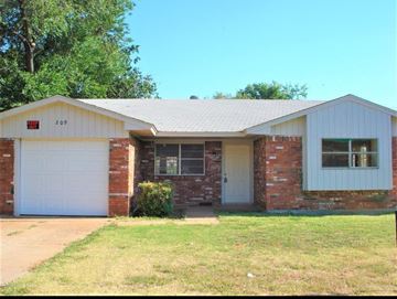 Oklahoma City house for rent - A two-story brick house with a white garage door.