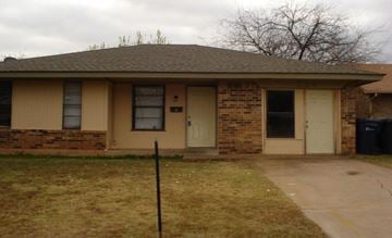 Oklahoma City house for rent - A house with a brown roof and a white door.