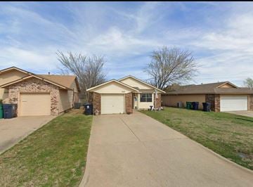 Oklahoma City house for rent - A row of houses with a driveway in the foreground.