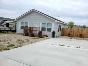 Trinidad apartment for rent - A house with a grey roof and a white garage door.