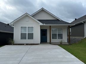 Little Rock house for rent - A house with a grey roof and a blue door.